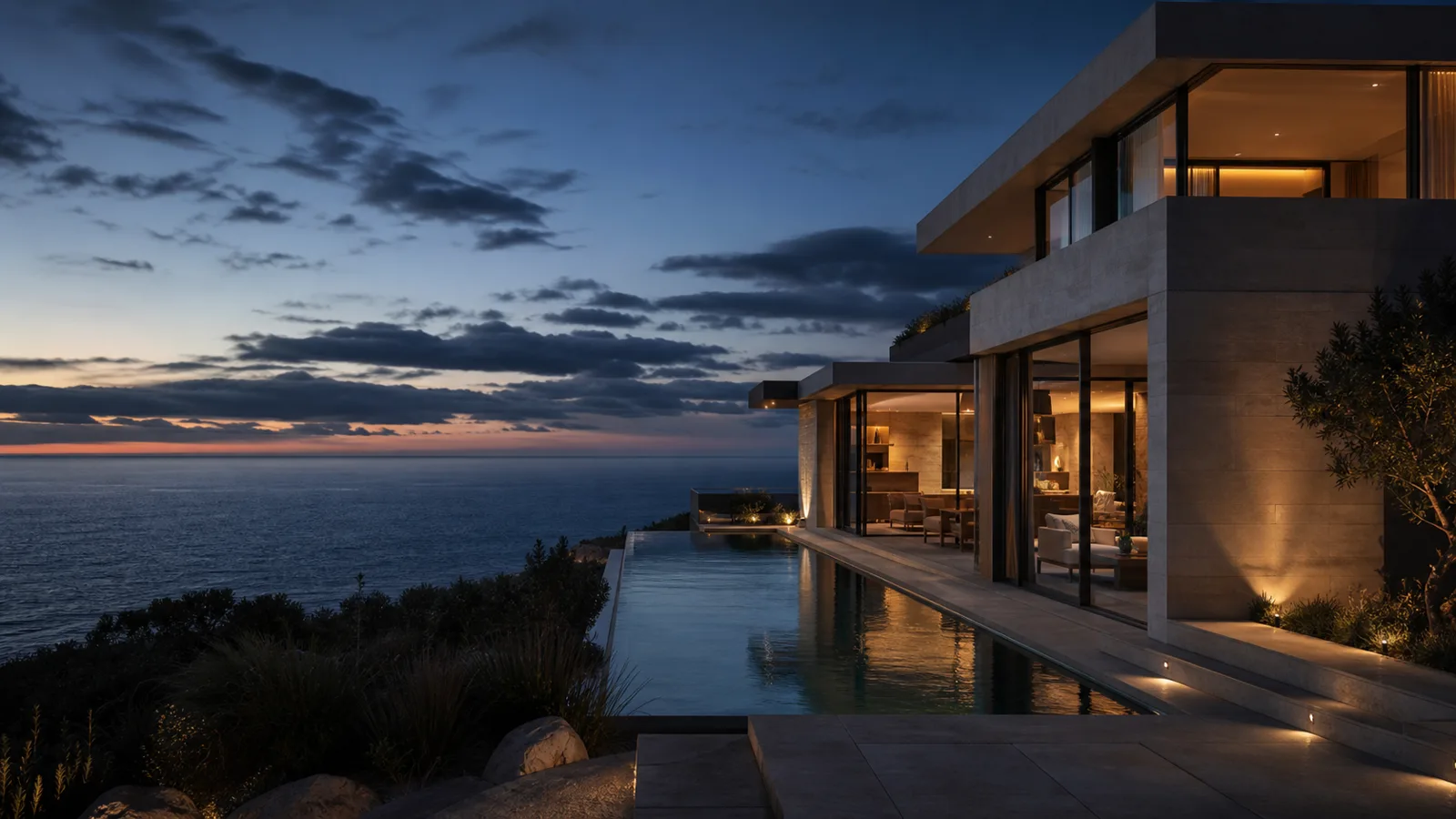 A secluded contemporary coastal villa at blue hour